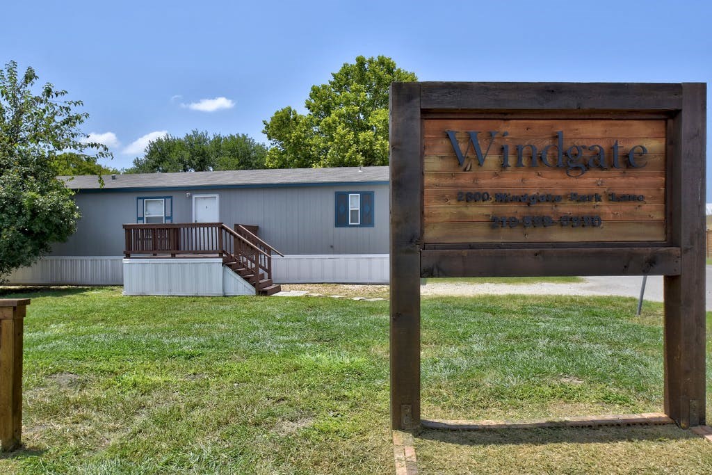 a house with a sign in front of it