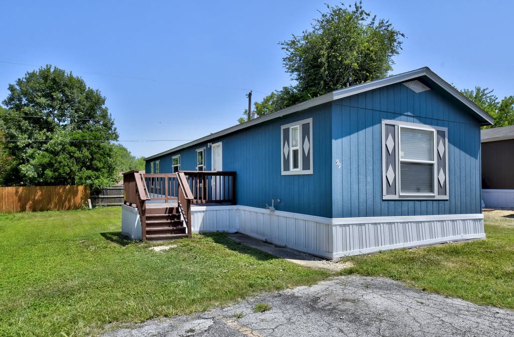a blue house with a blue sky in the background