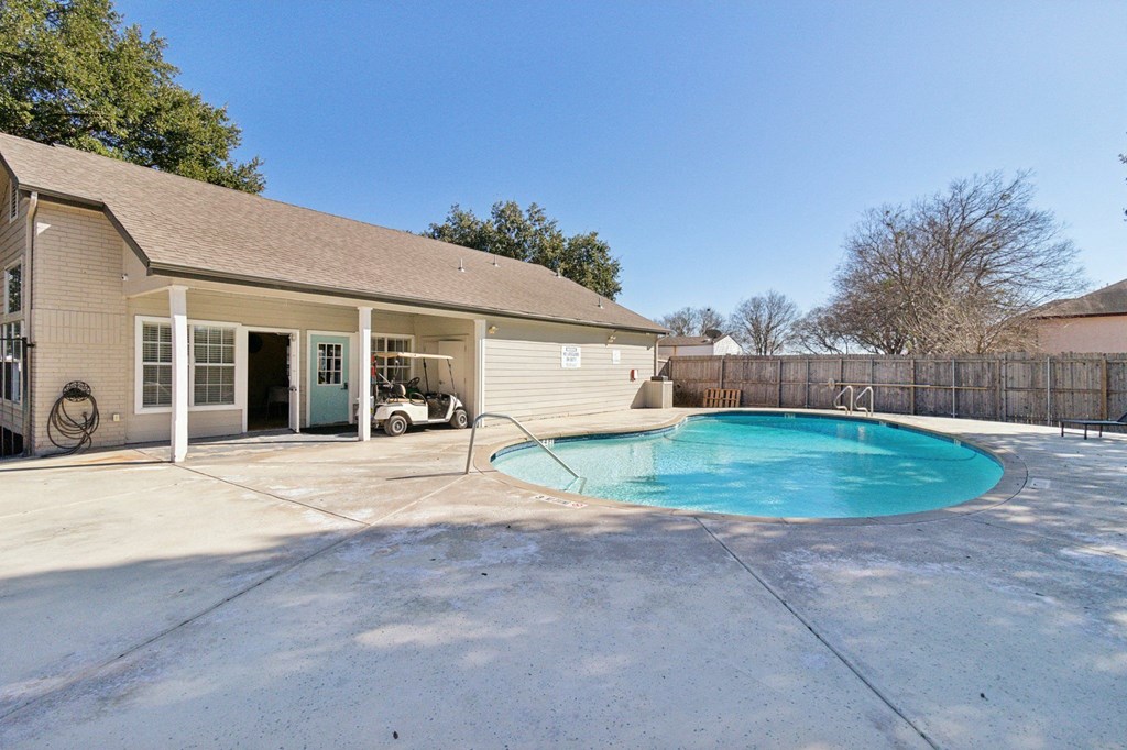 A house with a pool in the backyard.