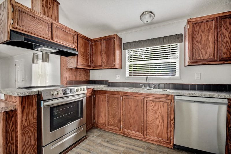 Kitchen with wooden closet at Country Oaks, San Antonio, TX, Texas
