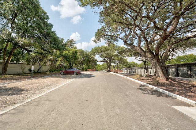 a red car parked on the side of a street