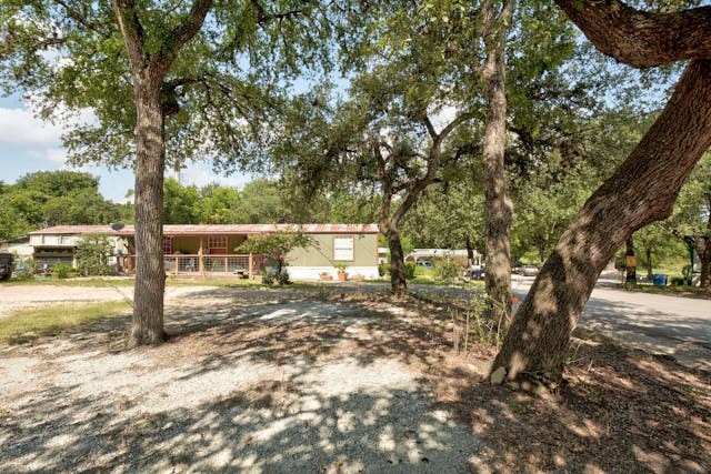a house with trees in front of it