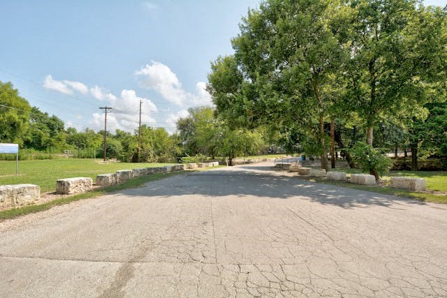 a empty street with trees on the side of it