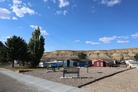 A park with a bench and a playground.