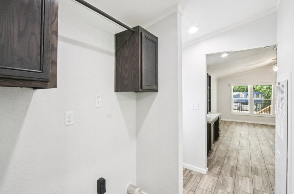 Hallway with washer and dryer hookups