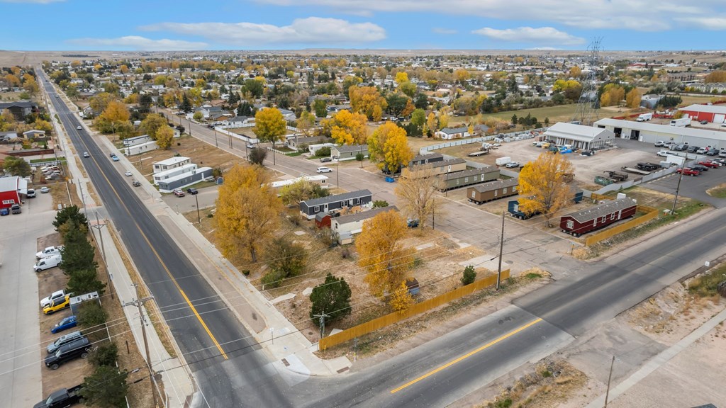 an aerial view of a city with a highway and trees at Country Lane, Wyoming