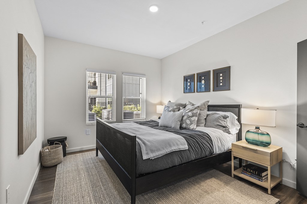 a bedroom with a large bed and a window