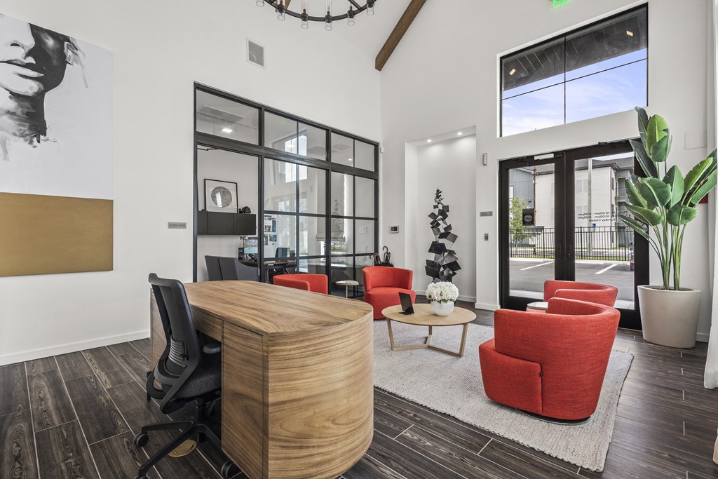 a living room with a large table and chairs