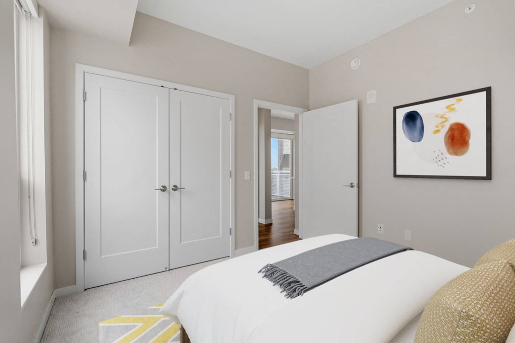private bedroom with French door closets at The Hallon Apartments, Hopkins, MN