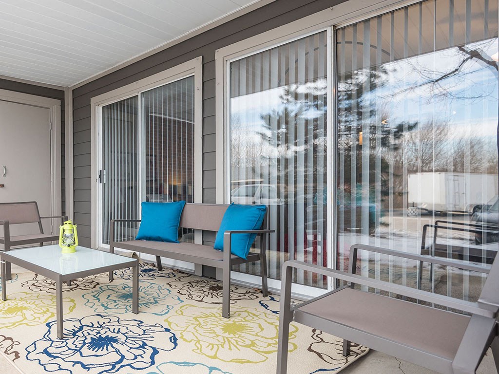 Private patio and balcony at Reflection Cove Apartments in Manchester, 63021