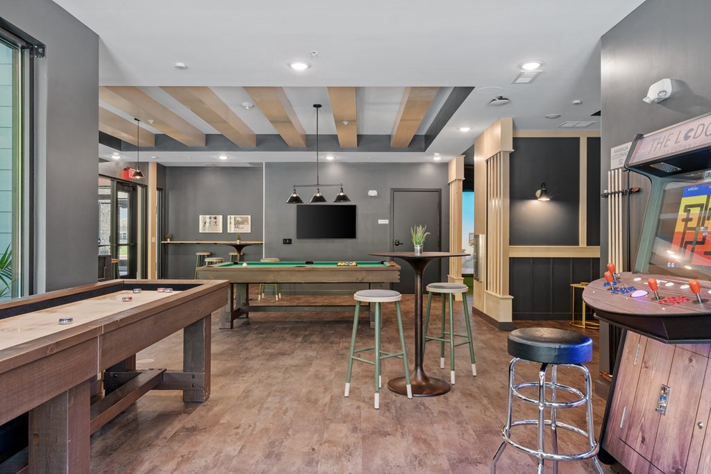 a games room with a pool table and foosball at The Lodge at Overland, Minnesota