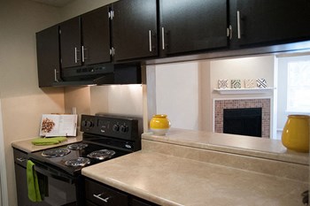 Newly Renovated Kitchen with ungraded appliances and espresso cabinets Newly Renovated Kitchen with ungraded appliances and espresso cabinets at Riverset Apartments in Mud Island, Memphis, TN - Photo Gallery 2