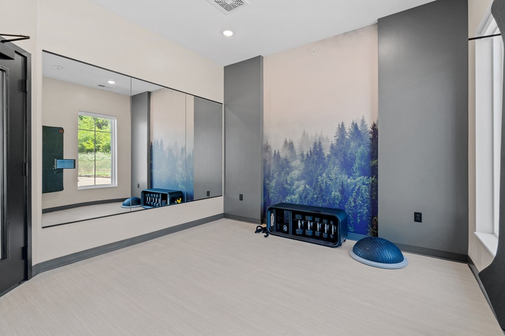 a yoga studio with a large painting on the wall at The Lodge at Overland, Minnesota, 55901