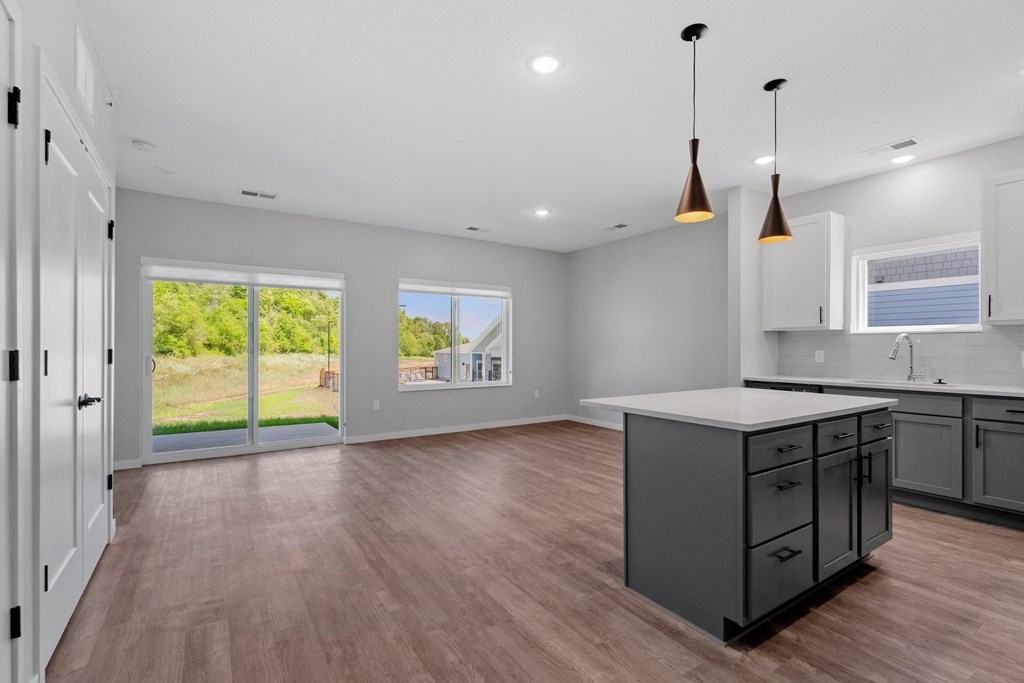 the living room and kitchen in a 555 waverly unit at The Lodge at Overland, Rochester, MN, 55901
