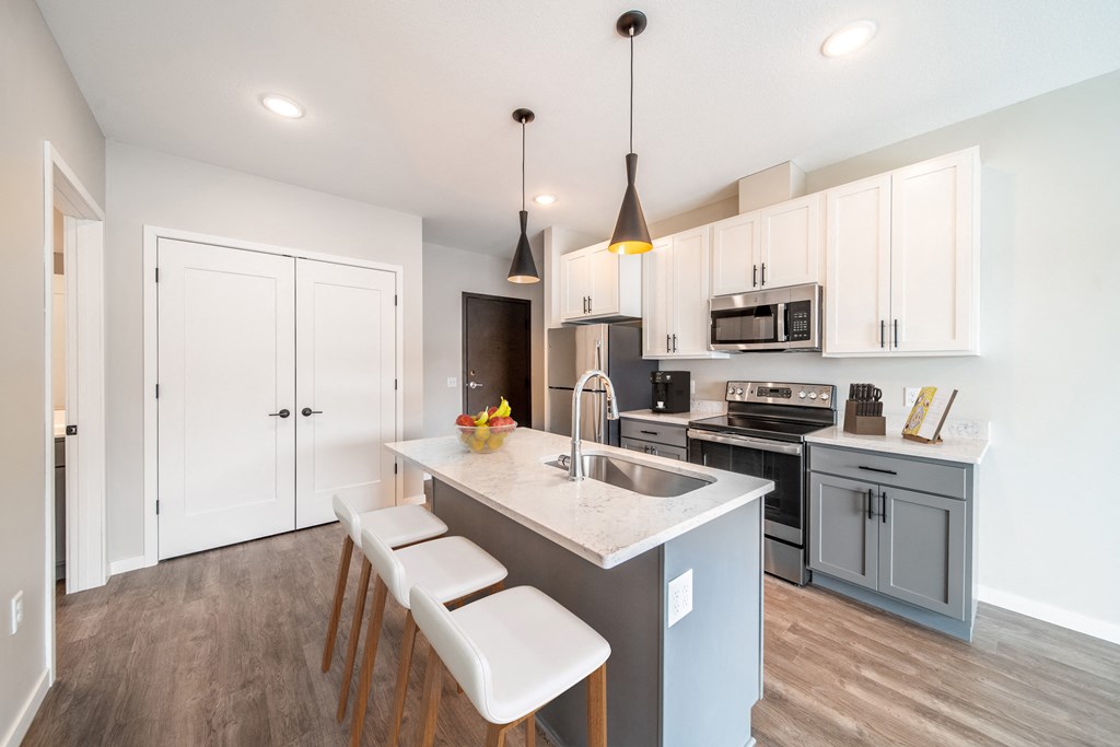Kitchen with white cabinets at The Lodge at Overland, Rochester, Minnesota
