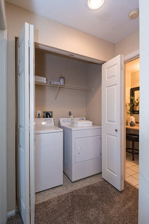 In home full size washer and dryer at Reflection Cove Apartments in Manchester, 63021