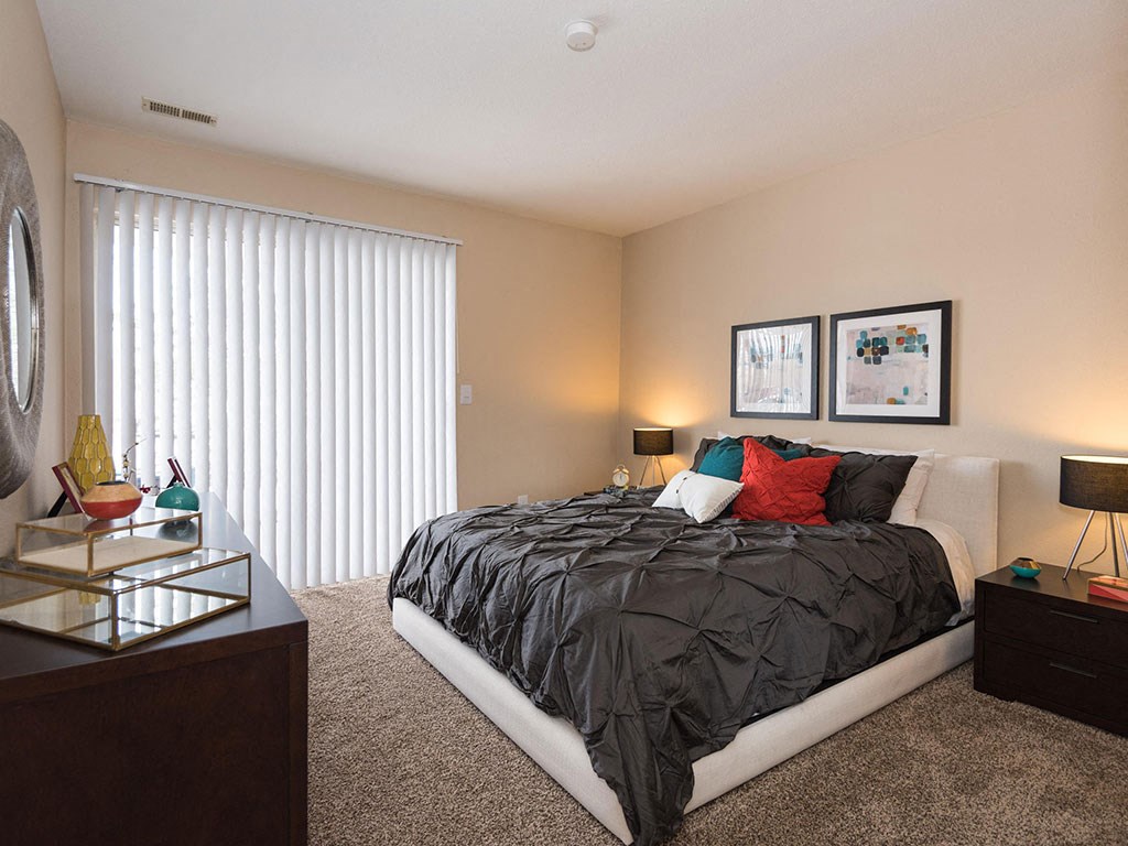 Manchester, MO Apartments with In-Unit Washer and Dryer - Reflection Cove - Spacious Bedroom with Plush Carpet Flooring and a Large Window with Blinds Manchester, MO Apartments with In-Unit Washer and Dryer - Reflection Cove - Spacious Bedroom with Plush Carpet Flooring and a Large Window with Blinds