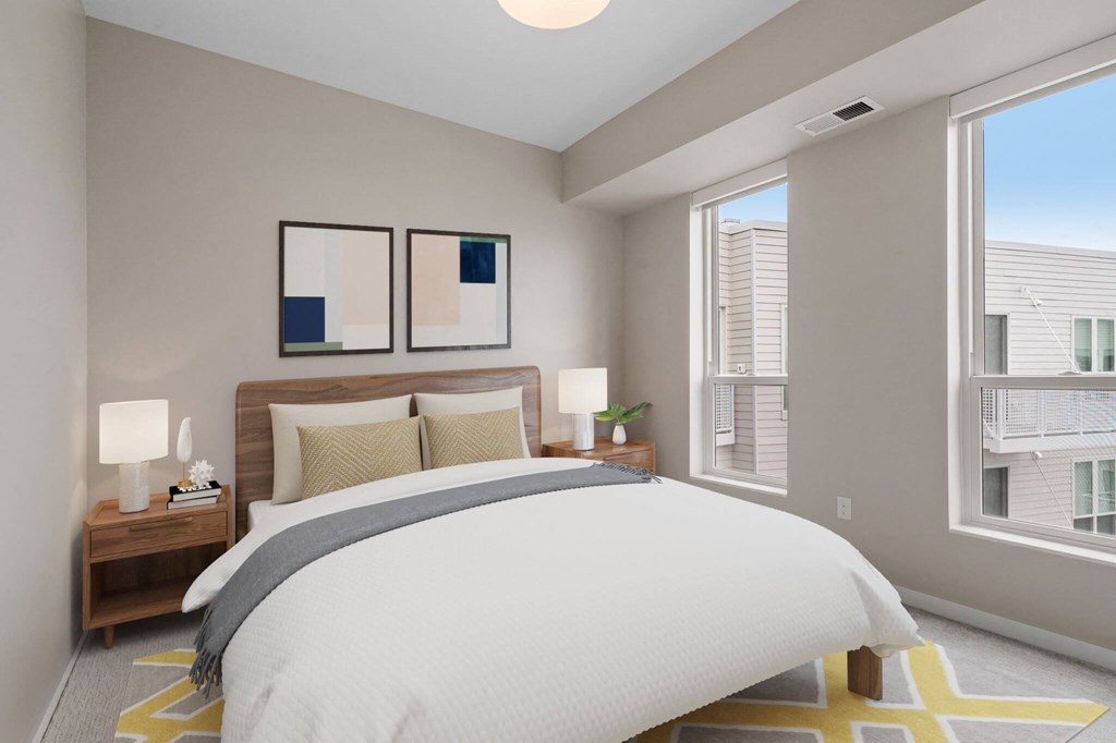 modern bedroom with queen bed at The Hallon Apartments, Hopkins, MN