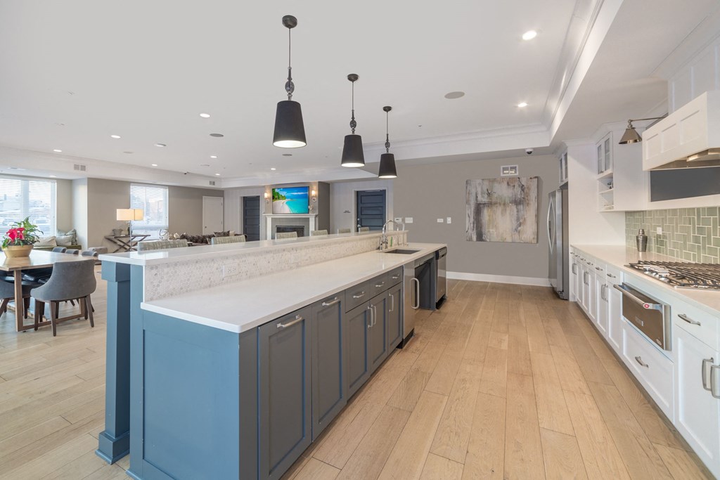 a large kitchen with a large island and a dining area