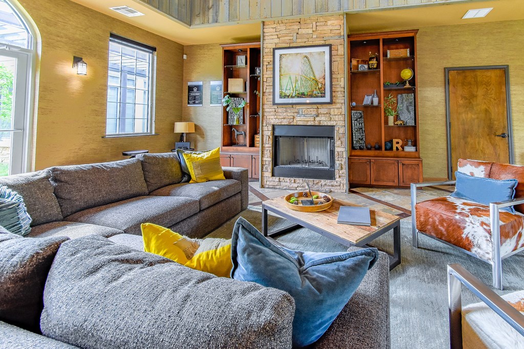 a living room with a fireplace and couches  at Riverset Apartments, Memphis