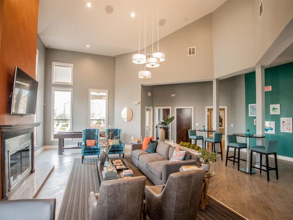 Lounge Area with Fireplace and Seating Area at  Waterford Place Apartments in Memphis TN
