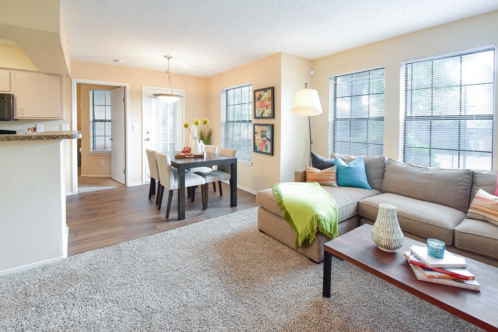 Living room with a couch and a dinning table at Park Laureate Apartments, Louisville, KY, 40220