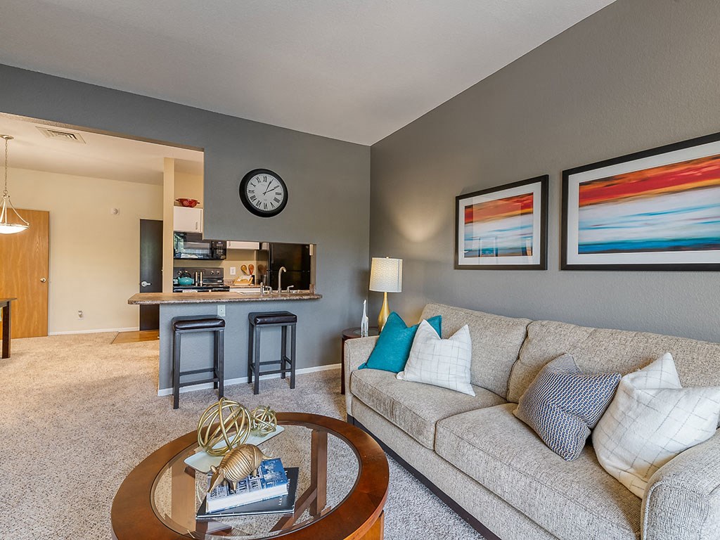 Living Room With Kitchen View at Waterchase Apartments, Wyoming, MI