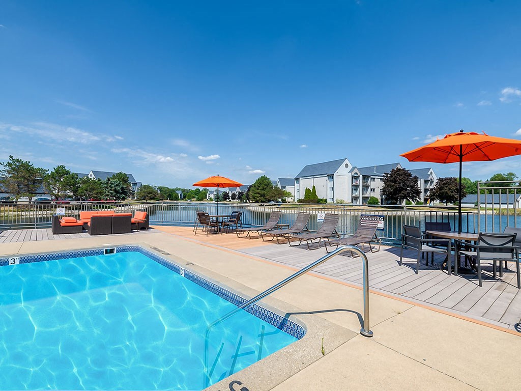 Resort-style swimming pool with sundeck at Waterchase Apartments, Michigan
