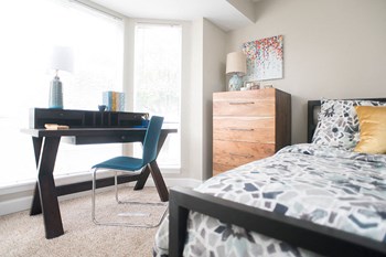 Bedroom with study table Bedroom with study table at The Pointe at St. Joseph Apartments, South Bend, IN - Photo Gallery 4