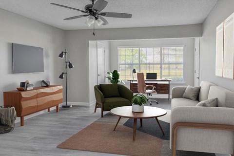 A living room with a green chair and a brown rug.