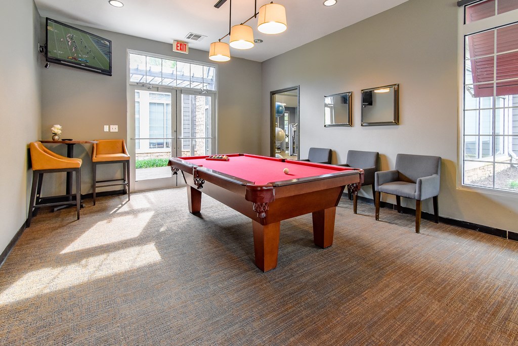 our apartments have a game room with a pool table and a flat screen tv our apartments have a game room with a pool table and a flat screen tv at Riverset Apartments in Mud Island, Memphis, TN