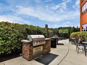 Exterior grill area at Residences at The Streets of St. Charles in Missouri