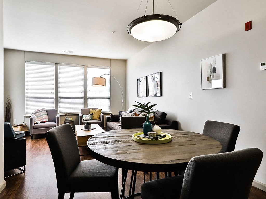 Wooden Dining table at Residences at The Streets of St. Charles Apartments in St. Charles, MO