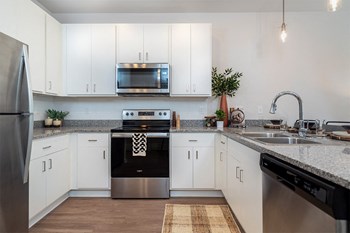Apartment Kitchen Apartment Kitchen at Volaris, Lansing, MI, 48910 - Photo Gallery 4