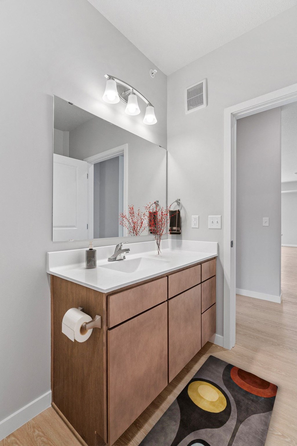 a bathroom with a white sink and a mirror at The Aurilla, Cottage Grove