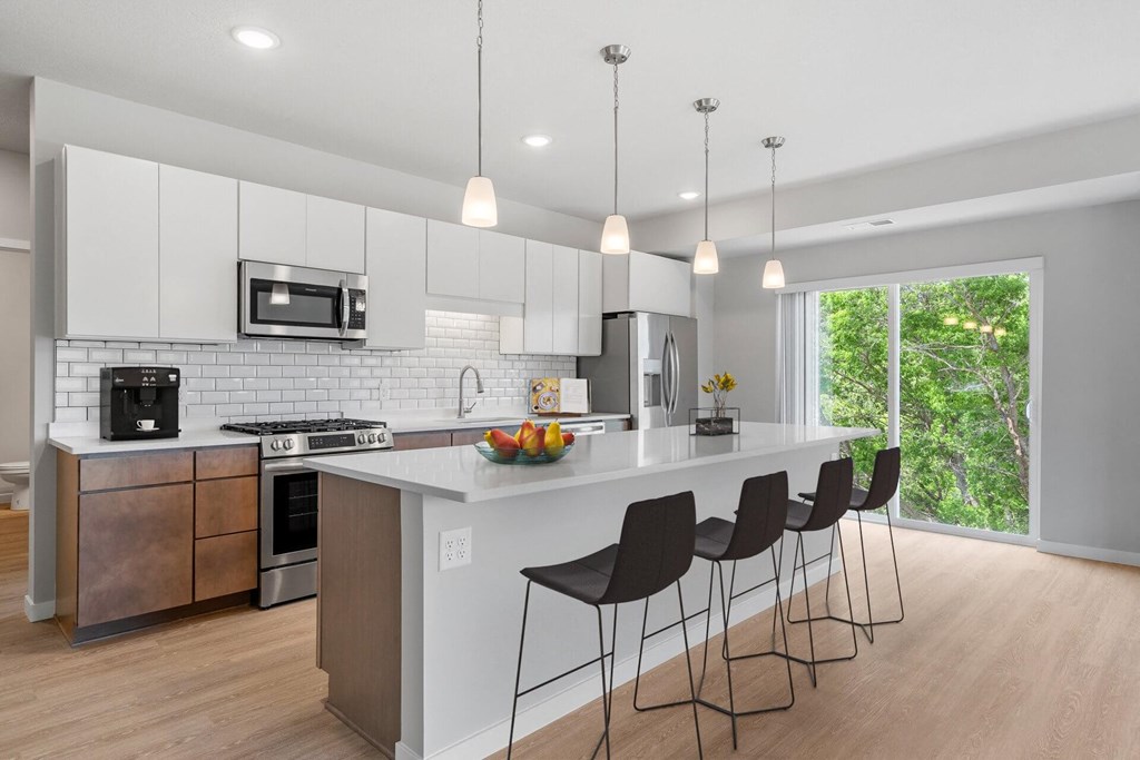 Kitchen with White Cabinets at The Aurilla, Cottage Grove, Minnesota