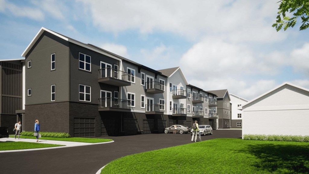 a rendering of an apartment complex with people walking in front of it at The Commons at Rivertown, Michigan