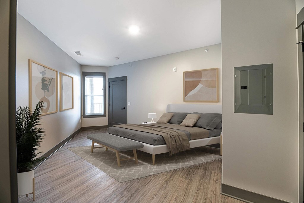 a bedroom with a large bed and a rug at The Commons at Rivertown, Michigan, 49418