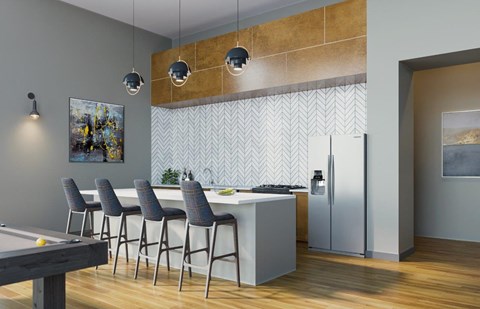 A modern kitchen with a pool table and bar stools.