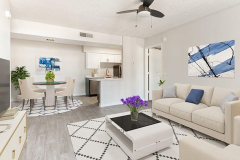 A living room with a white couch and a coffee table.