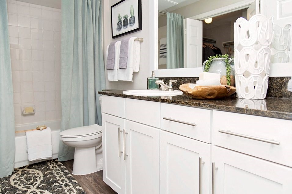 Model bathroom with white cabinets