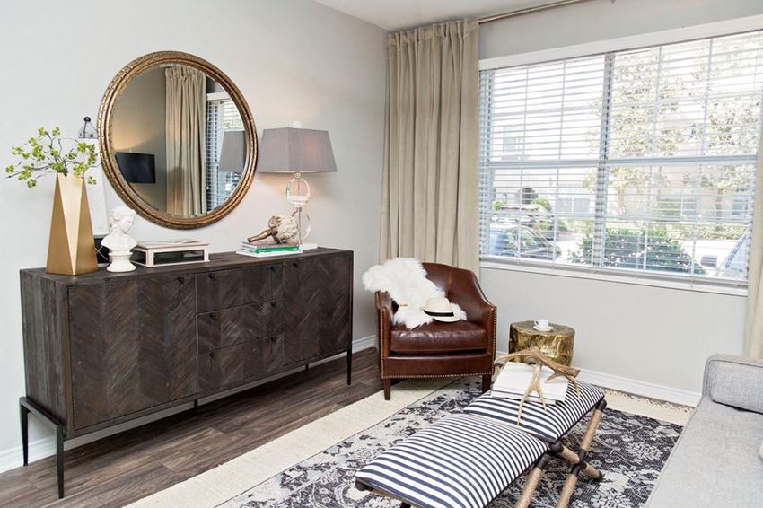 Model home living room with console and mirror
