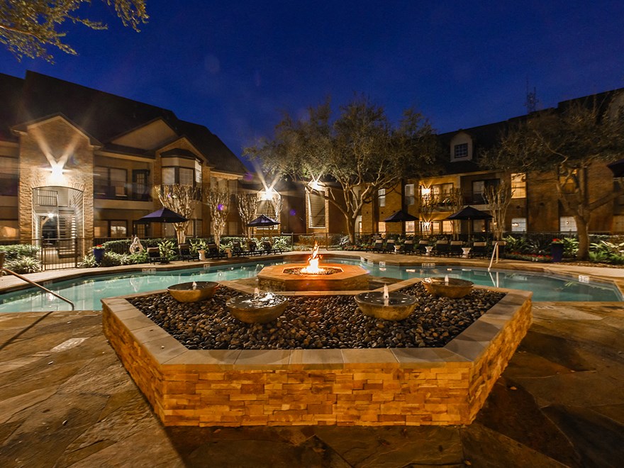 fire pit at night  at The Villages of Briar Forest, Houston, 77077