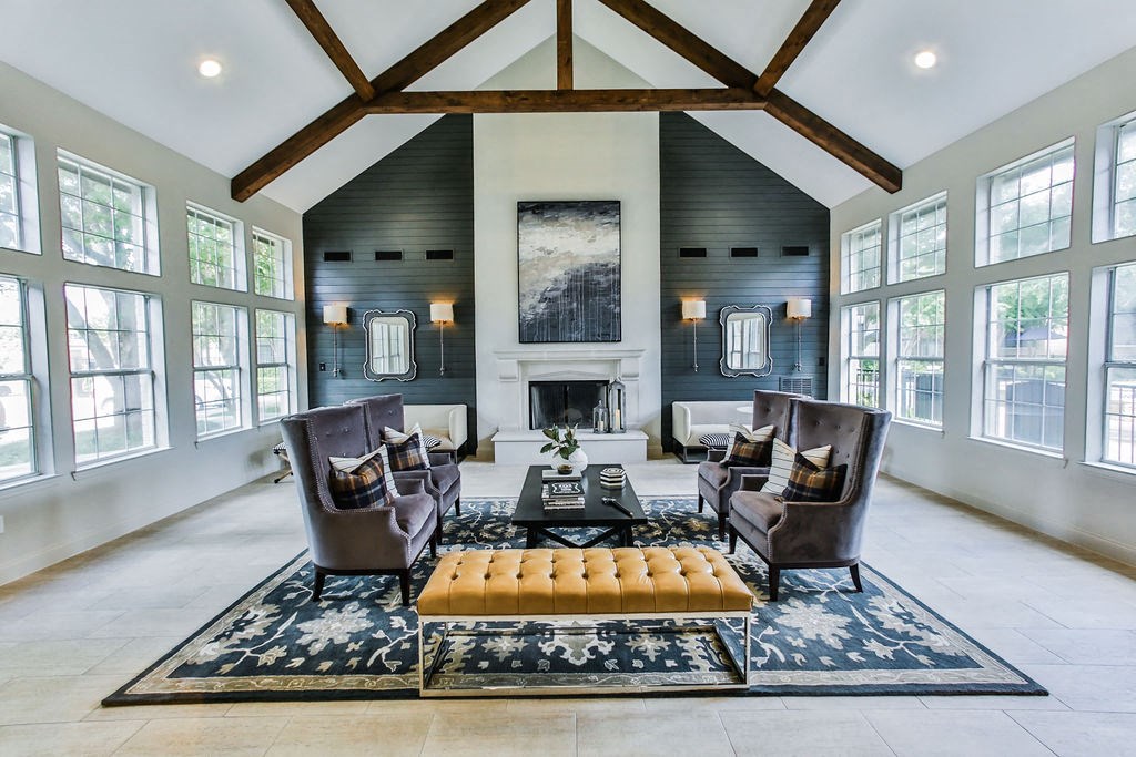 Community lounge seating area with fireplace  at The Villages of Briar Forest, Houston, 77077
