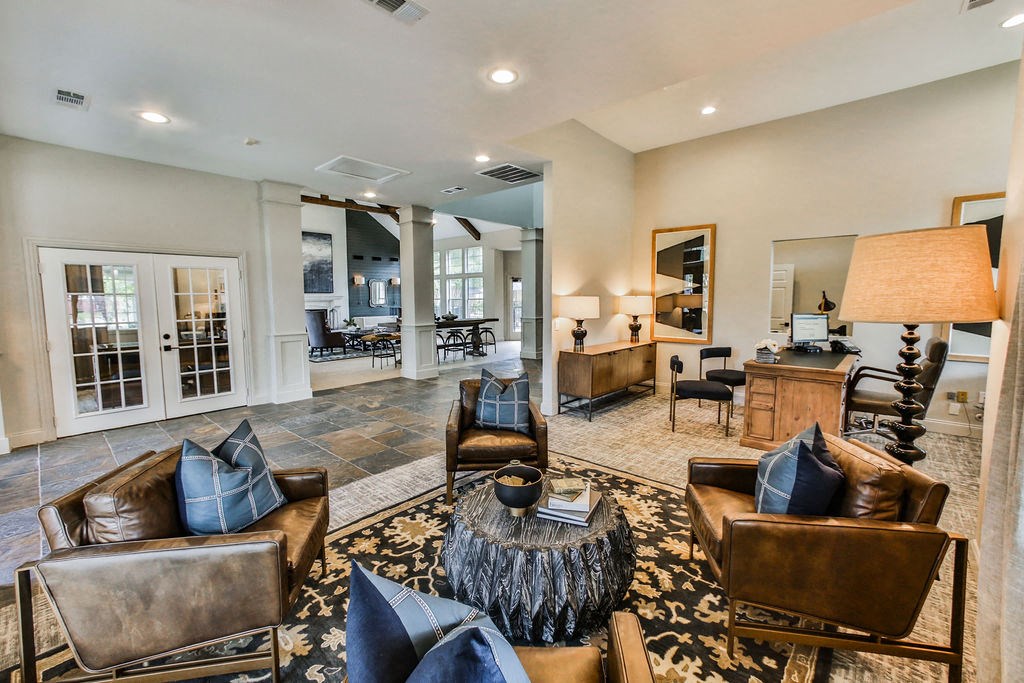 Community lounge seating area with fireplace  at The Villages of Briar Forest, Houston, 77077