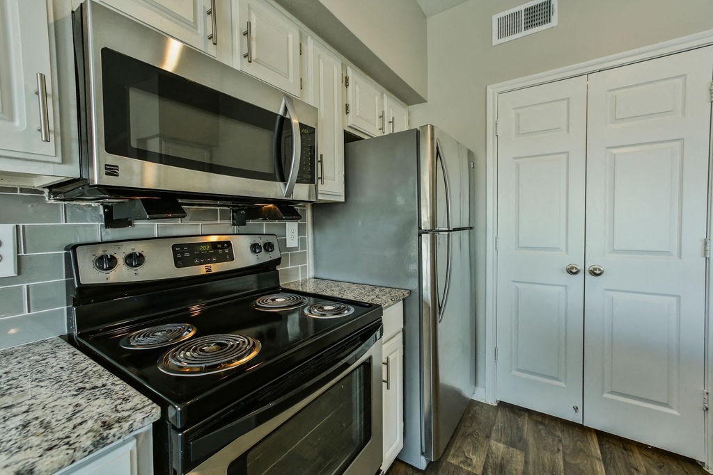 Wimberly Floorplan, kitchen with stove and microwave  at The Villages of Briar Forest, Houston, 77077