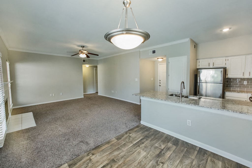 White Oak Floorplan with kitchen and living room  at The Villages of Briar Forest, Texas