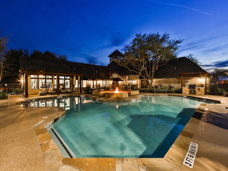 Pool at night  at The Villages of Briar Forest, Texas