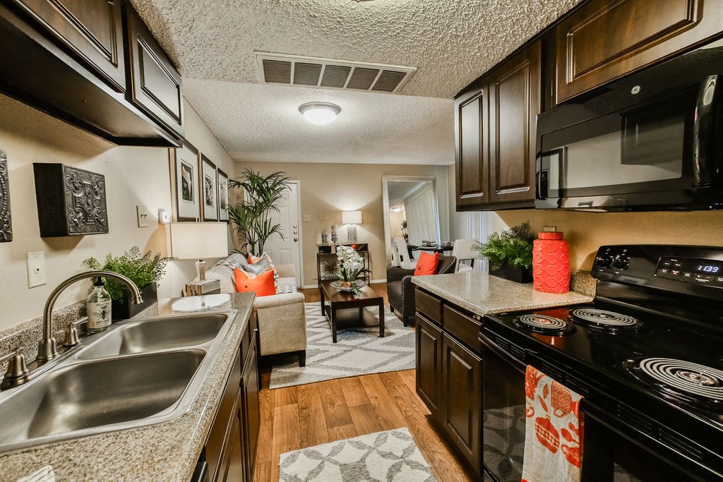 interior kitchen with living room at Oaks at Greenview, Houston