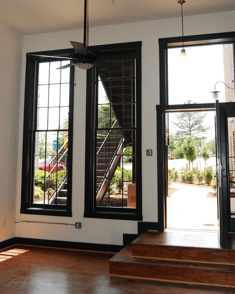 A room with a staircase and a window.